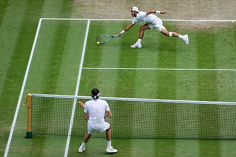 Lorenzo Musetti of Italy plays a return to Taylor Fritz